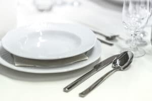 White dinner plate, knife and spoon